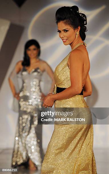 Filipino actress and singer Patricia Javier models in an evening dress as she competes in the first round of the Mrs Asia USA beauty competition in...