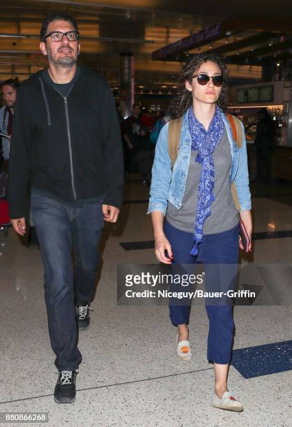 Emmy Rossum and Sam Esmail are seen at Los Angeles International Airport on November 27, 2017 in Los Angeles, California.