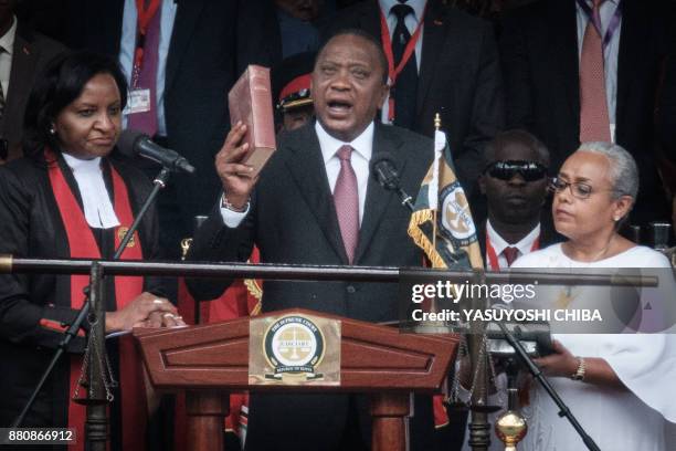 Kenya's President Uhuru Kenyatta takes oath of office during his inauguration ceremony at Kasarani Stadium in Nairobi, Kenya, on November 28, 2017....