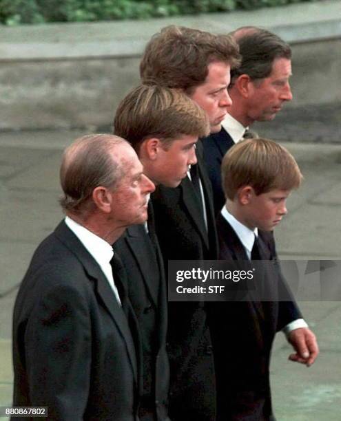 Prince Philip, Prince William, Earl Spencer, Diana's brother, Prince Harry, and Prince Charles walk together behind the carriage carrying the casket...