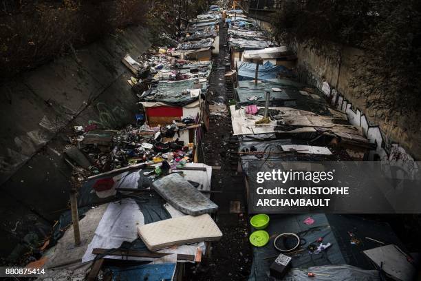 Picture taken on November 28, 2017 shows an abandoned makeshift camp after Roma people were evacuated by police, along a decommissioned railway track...