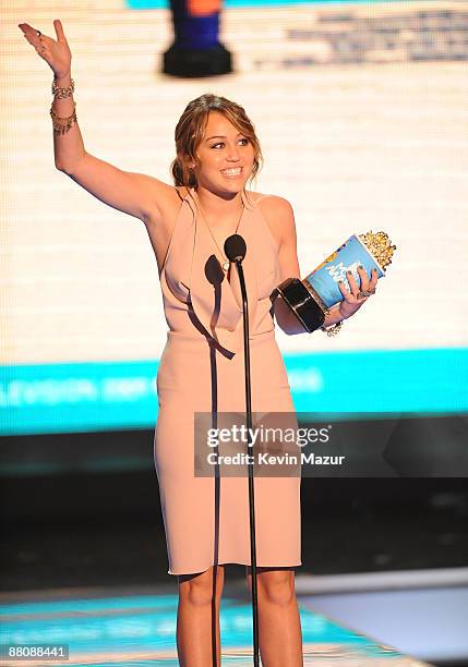 Singer Miley Cyrus onstage during the 2009 MTV Movie Awards held at the Gibson Amphitheatre on May 31, 2009 in Universal City, California.