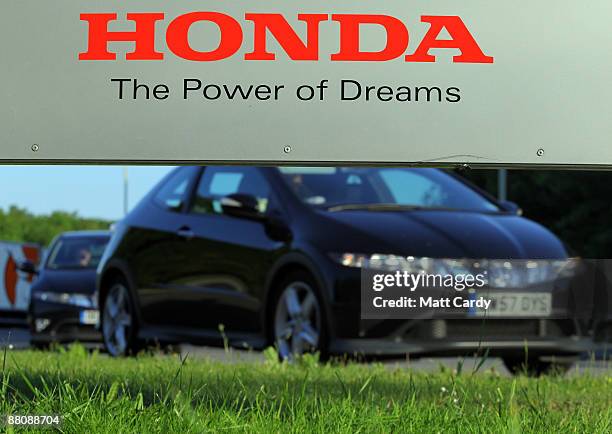 Workers return to work at the Honda factory after a four month shutdown on June 1, 2009 in Swindon, England. The re-opening of the plant, which...