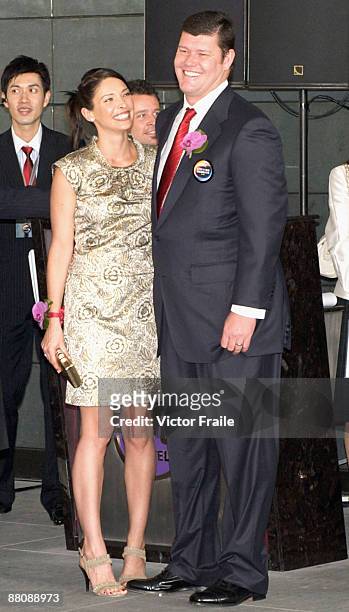 Businessman James Packer and wife Erica Baxter laugh during the opening of Packer and Lawrence Ho's 'City of Dreams' casino on June 1, 2009 in Cotai,...