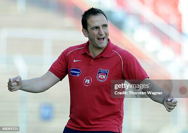 Frank Schmidt, head coach of Heidenheim gestures during the Regionalliga match between Karlsruher SC II and 1.FC Heidenheim at the Wildpark stadium...