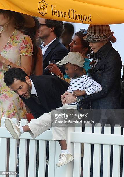 Marc Jacobs and Madonna with her son David watch the 2009 Veuve Clicquot Manhattan Polo Classic on Governor's Island on May 30, 2009 in New York City.