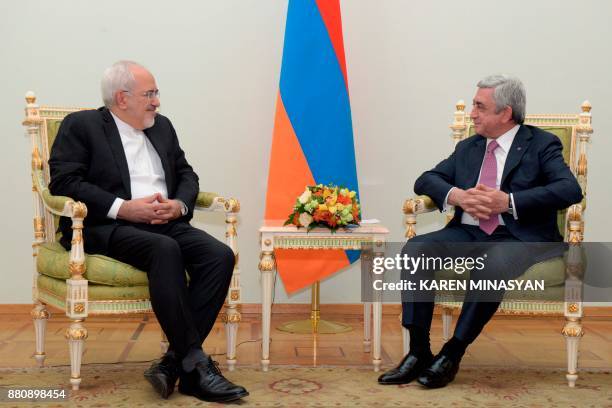 Armenia's President Serzh Sargsyan meets with Iranian Foreign Minister Mohammad Javad Zarif in Yerevan on November 28, 2017. / AFP PHOTO / Karen...