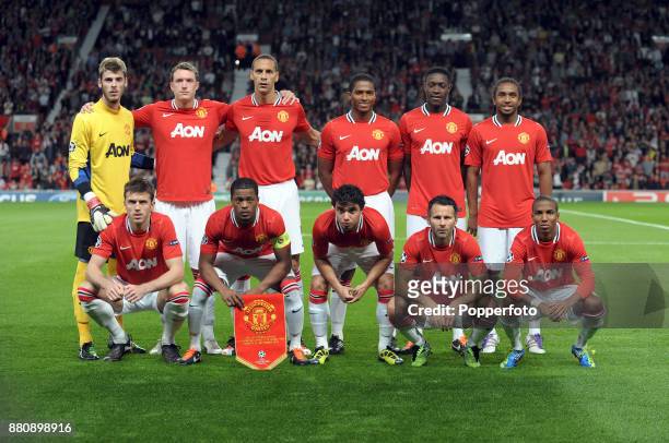 Manchester United line up for a group photo before the UEFA Champions League match between Manchester United and FC Basel at Old Trafford on...