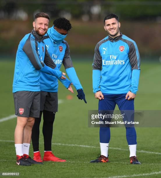 Shodran Mustafi, Alex Iwobi and Sead Kolasinac of Arsenal during a training session at London Colney on November 28, 2017 in St Albans, England.