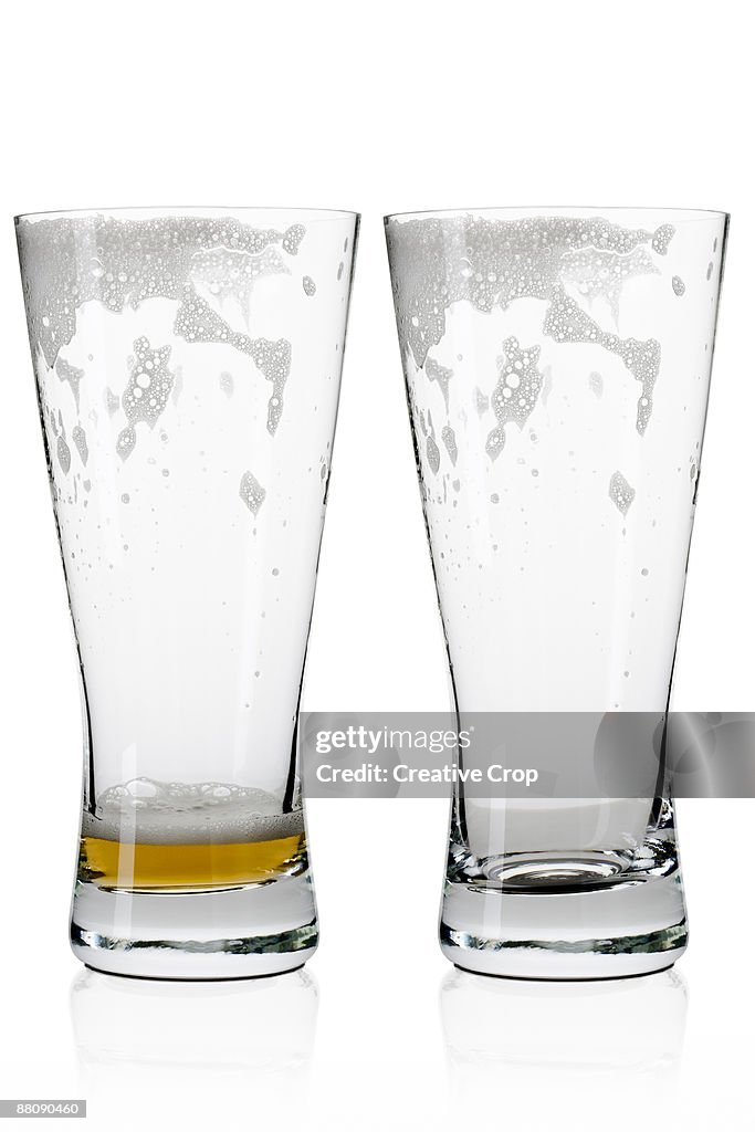 Two empty beer / lager glasses 