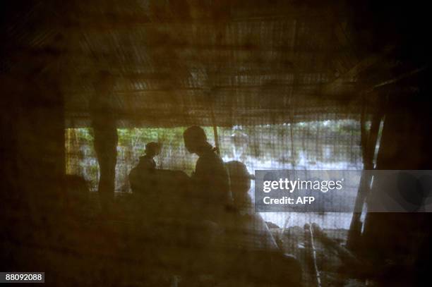 Displaced family settle in a makeshift shelter in the Koyra area on the outskirts of Khulna, some 400 kms from Dhaka on June 1, 2009. Bangladesh and...