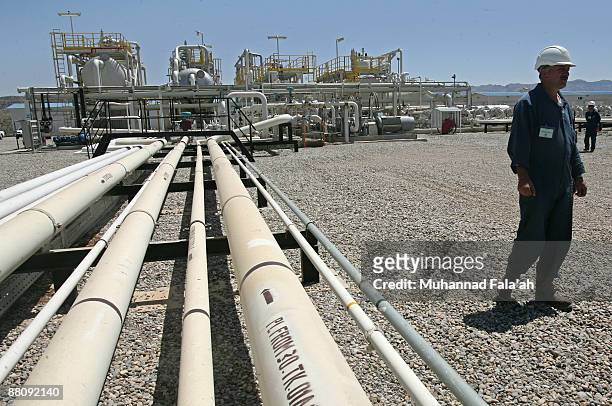 Kurdish engineers and other employees work at the Tawke oil field near the town of Zacho on May 31, 2009 in Dohuk province about 250 miles north of...