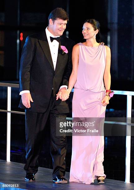 Businessman James Packer and wife Erica Baxter arrive to the grand opening ceremony of Packer and Lawrence Ho's 'City of Dreams' casino on June 1,...