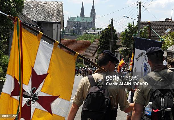 People walk towards the Chartres cathedral on June 1, 2009 during the annual Pentecost pilgrimages, in Chartres. Pentecost, also known in Britain as...