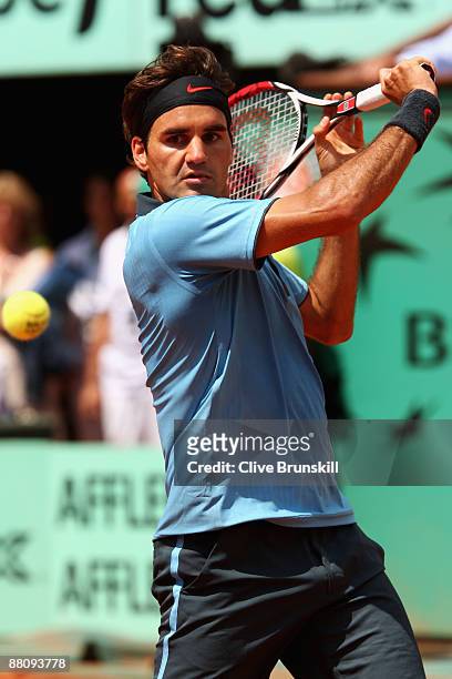 Roger Federer of Switzerland hits a backhand during the Men's Singles Fourth Round match against Tommy Haas of Germany on day nine of the French Open...