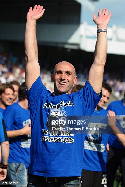 Head coach Andre Schubert of Paderborn celebrates the ascension to the Second Bundesliga after the Second Bundesliga Play Off match between VfL...