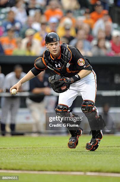 Matt Wieters of the Baltimore Orioles fields a bunt against the Detroit Tigers on May 29, 2009 at Camden Yards in Baltimore, Maryland.