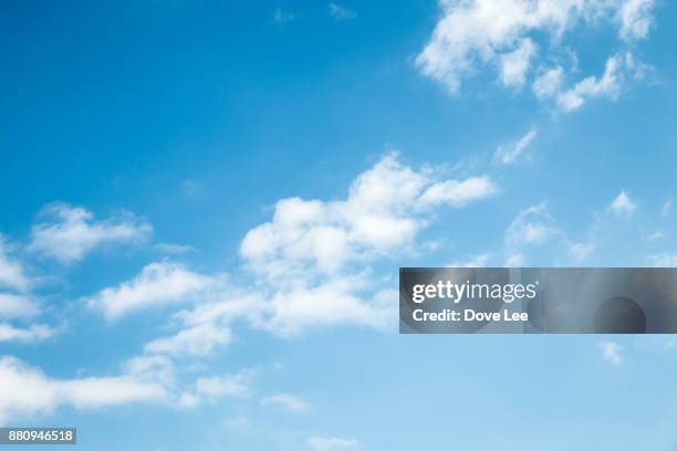 clouds in blue sky - blue clouds stockfoto's en -beelden