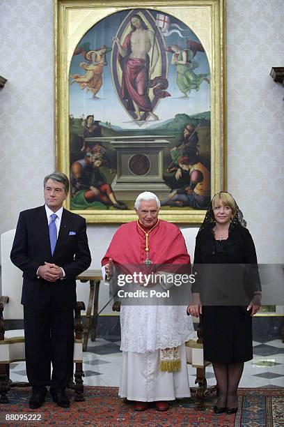 Pope Benedict XVI poses with Ukrainian President Victor Yushchenko and his wife Kateryna Mykhailiva Yushchenko during their meeting at his private...