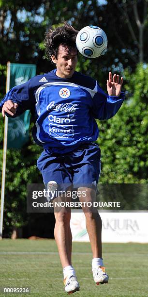 Footballer Aureliano Torres, heads the ball during a training session of the Paraguayan national team in Luque, Paraguay on June 1, 2009. The...