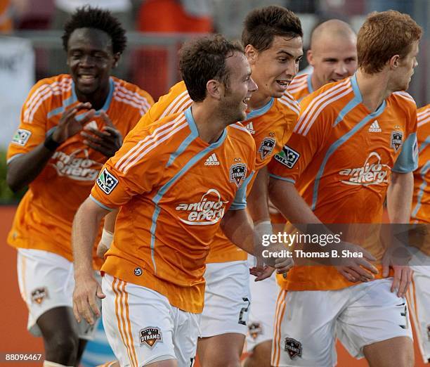 Brad Davis of the Houston Dynamo celebrates his goal with teammates against the Toronto FC at Robertson Stadium on May 30, 2009 in Houston, Texas....