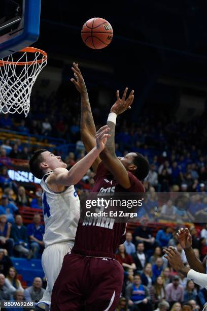 Trayvon Reed of the Texas Southern Tigers shoots against Mitch Lightfoot of the Kansas Jayhawks at Allen Fieldhouse on November 21, 2017 in Lawrence,...