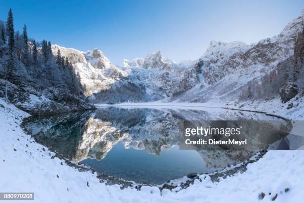 gosausee reflection with mount dachstein in winter, european alps - upper austria stock pictures, royalty-free photos & images