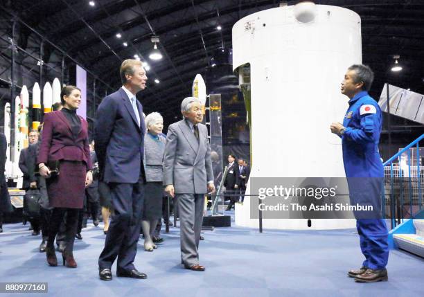 Grand Duke Henri of Luxembourg, his daughter Princess Alexandra of Luxembourg, Emperor Akihito and Empress Michiko listen to the explanation during...