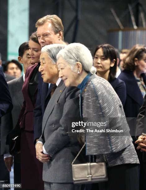 Grand Duke Henri of Luxembourg, his daughter Princess Alexandra of Luxembourg, Emperor Akihito and Empress Michiko listen to the explanation during...