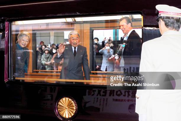 Grand Duke Henri of Luxembourg, Emperor Akihito and Empress Michiko are seen in the coach of the special train at Tokyo Station on November 28, 2017...