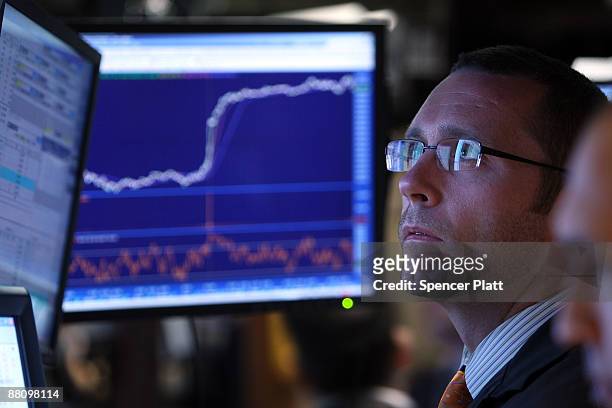 Trader works on the floor of the New York Stock Exchange moments before the closing bell on June 1, 2009 in New York City. Despite the news of...