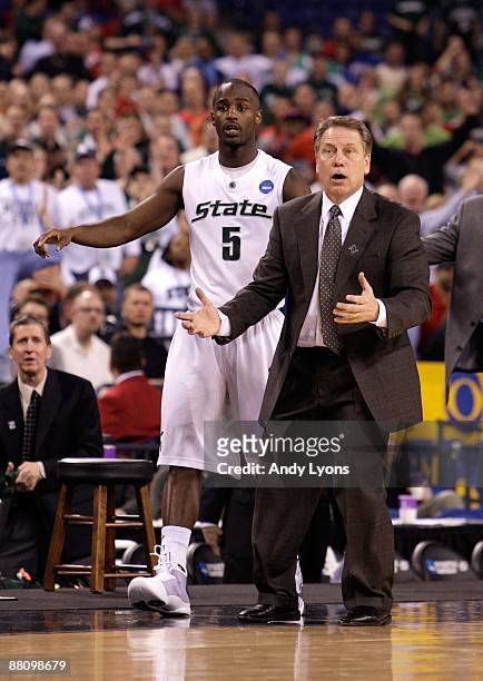 Travis Walton and head coach Tom Izzo of the Michigan State Spartans react against the Kansas Jayhawks during the third round of the NCAA Division I...