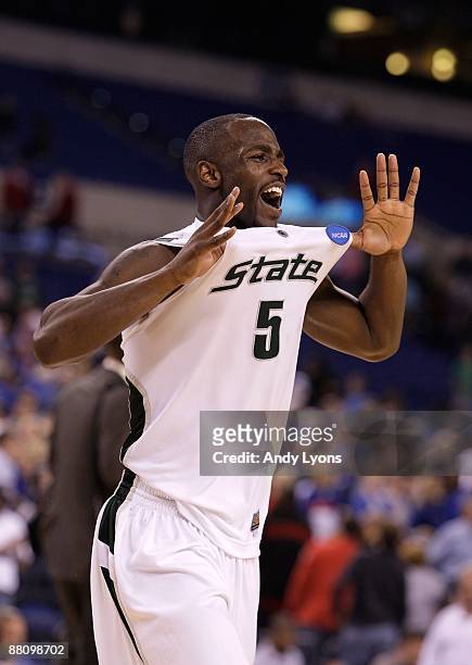 Travis Walton of the Michigan State Spartans celebrates as he runs off the court after Michigan State's 67-62 win against the Kansas Jayhawks during...