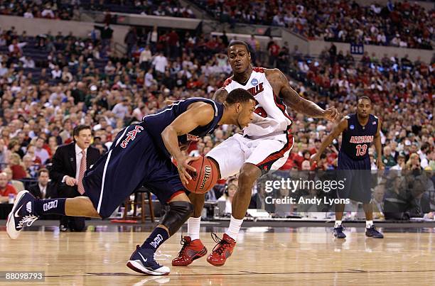 Earl Clark of the Louisville Cardinals defends against Jamelle Horne of the Arizona Wildcats during the third round of the NCAA Division I Men's...