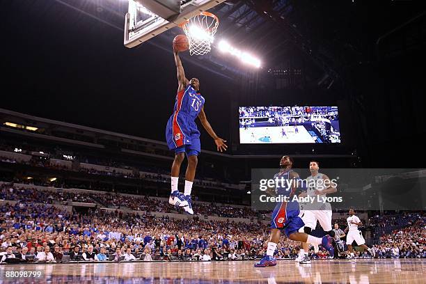 Tyshawn Taylor of the Kansas Jayhawks dunks against the Michigan State Spartans during the third round of the NCAA Division I Men's Basketball...