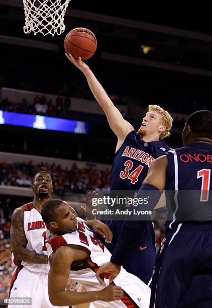 Chase Budinger of the Arizona Wildcats drives for a shot attempt against the Louisville Cardinals during the third round of the NCAA Division I Men's...