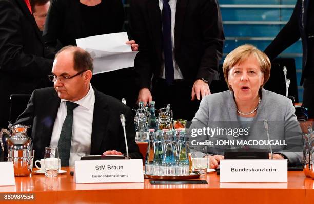 German Agriculture Minister Christian Schmidt and German Chancellor Angela Merkel attend a so-called "Diesel Summit" with mayors of large German...
