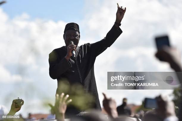 Leader of opposition Raila Odinga addresses his supporters on November 28, 2017 during demonstrations at Umoja subururb of capital Nairobi, after...