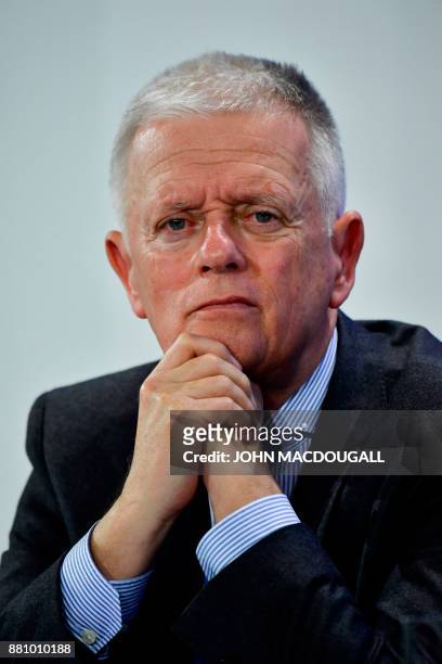 Stuttgart's mayor Fritz Kuhn looks on during a press conference after the so-called "Diesel Summit" with the German Chancellor and mayors of large...