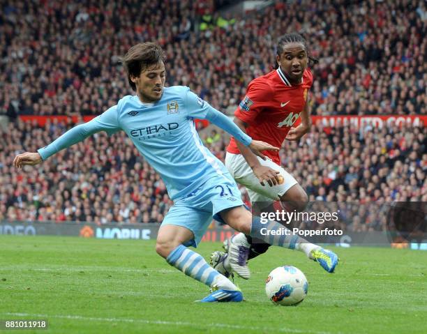 David Silva of Manchester City turns away from Anderson of Manchester United during a Barclays Premier League match at Old Trafford on October 23,...