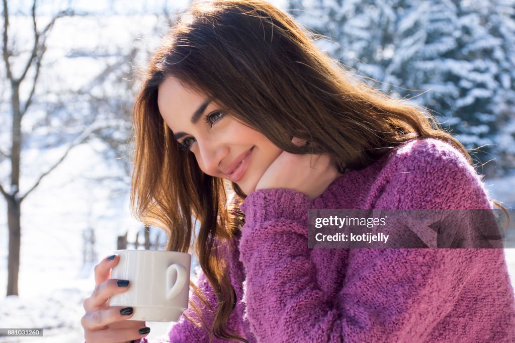 A pretty woman enjoying a winter morning