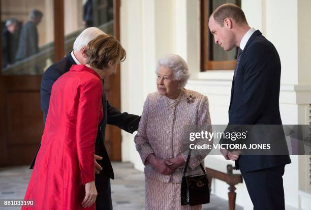 Britain's Queen Elizabeth II and her grandson Britain's Prince William, Duke of Cambridge , greet Germany's President Frank-Walter Steinmeier and his...