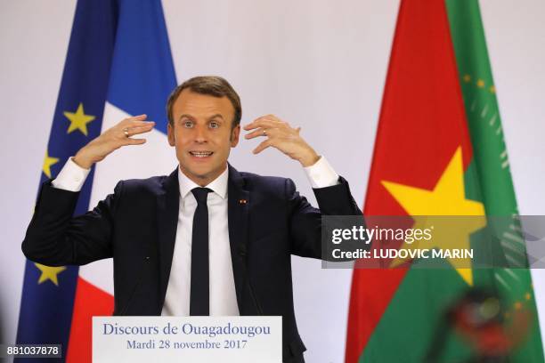 French President Emmanuel Macron speaks at the Ouagadougou University, in Ouagadougou, on November 28 as part of his first African tour since taking...