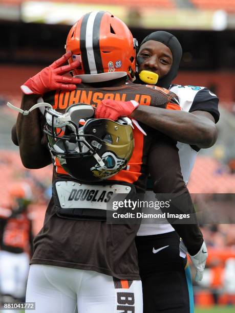 Safety Tashaun Gipson of the Jacksonville Jaguars and running back Duke Johnson Jr. #29 of the Cleveland Browns embrace prior to a game on November...