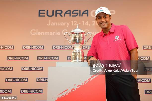 Arjun Atwal of India, Team Asia Captain, poses with the trophy during the Team Asia Press Conference ahead of the 2018 EurAsia Cup presented by...