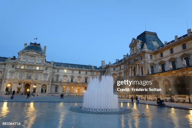 The Louvre Pyramid in Paris. The Louvre Pyramid is a large glass and metal pyramid designed by the architect I. M. Pei, surrounded by three smaller...