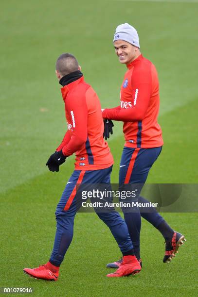 Marco Verratti, and Hatem Ben Arfa react during a Paris Saint-Germain training session at Centre Ooredoo on November 28, 2017 in Paris, France.