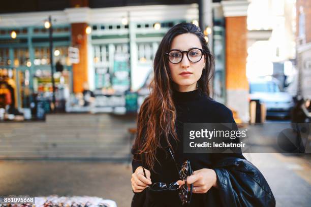 woman shopping in east london second hand marketplace - east london stock pictures, royalty-free photos & images