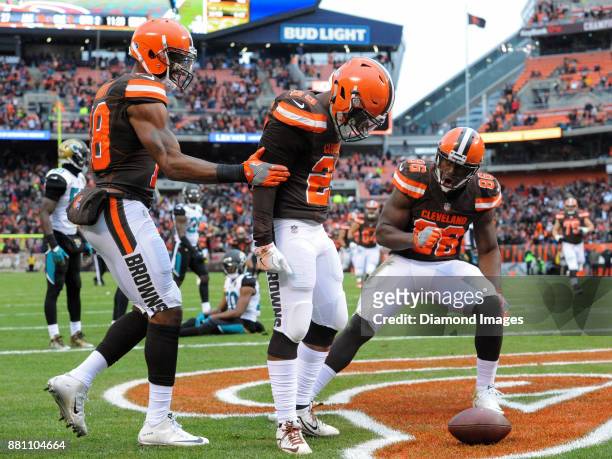 Running back Duke Johnson Jr. #29 of the Cleveland Browns celebrates with wide receiver Kenny Britt and tight end Randall Telfer, after scoring a...