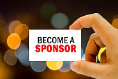 become a sponsor written on business card